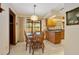 Bright breakfast nook featuring tile floors and a view of the pool through a sliding glass door at 808 Jutland St, Deltona, FL 32725