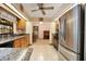 Well-lit kitchen featuring stainless steel appliances and granite countertops at 808 Jutland St, Deltona, FL 32725