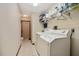 Laundry room with washer, dryer, and storage shelves at 808 Jutland St, Deltona, FL 32725