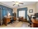 Well-lit office space with multiple desks and neutral carpeting at 808 Jutland St, Deltona, FL 32725
