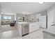 Bright kitchen with an island overlooking the living area, ideal for entertaining and everyday living at 811 Grand Park Ct, Deland, FL 32724