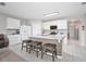 Modern kitchen with a stylish island featuring seating, complemented by sleek white cabinetry and appliances at 811 Grand Park Ct, Deland, FL 32724
