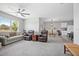 Spacious living room with ample seating and a large window, providing abundant natural light and scenic views at 811 Grand Park Ct, Deland, FL 32724