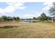 Community pond view featuring a fountain and surrounding landscaping at 811 Grand Park Ct, Deland, FL 32724