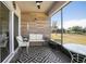 Inviting screened patio with wood paneling, seating, ceiling fan, and a view of the backyard at 811 Grand Park Ct, Deland, FL 32724