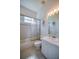 Clean bathroom with shower-tub combo and a well-lit vanity mirror at 823 Wooddusk Dr, Port Orange, FL 32127
