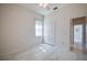 Bright bedroom with white closet doors, a window, and wood-look flooring at 823 Wooddusk Dr, Port Orange, FL 32127