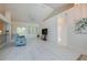 Open concept living room with light floors, high ceilings, and ample natural light at 823 Wooddusk Dr, Port Orange, FL 32127
