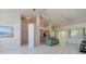 Spacious open-concept living room featuring light floors, high ceilings, and ample natural light at 823 Wooddusk Dr, Port Orange, FL 32127