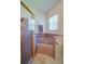 Elegant bathroom featuring a jacuzzi tub, an enclosed glass shower, and neutral decor at 823 Wooddusk Dr, Port Orange, FL 32127