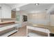 Spacious dining room features white cabinets and a view to the backyard at 825 Baltimore Dr, Orlando, FL 32810