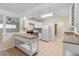 Functional kitchen boasts white appliances, plenty of counter space, and tile floors at 825 Baltimore Dr, Orlando, FL 32810