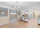 Open kitchen with a large center island, white cabinets, and modern appliances at 825 Baltimore Dr, Orlando, FL 32810