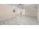 Spacious living room features sleek floors, neutral paint and a ceiling fan at 825 Baltimore Dr, Orlando, FL 32810