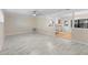 Open concept living room with a view of the kitchen and backyard at 825 Baltimore Dr, Orlando, FL 32810