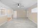 Bright living room with a ceiling fan and a view of the dining room at 825 Baltimore Dr, Orlando, FL 32810