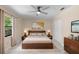 Serene main bedroom with a modern bed, warm lighting, and neutral decor at 825 Baltimore Dr, Orlando, FL 32810