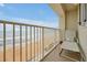 Comfortable lounge chair on a relaxing balcony overlooking the beach at 89 S Atlantic Ave # 505, Ormond Beach, FL 32176