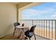 Balcony view of a table and chair seating with an ocean view at 89 S Atlantic Ave # 505, Ormond Beach, FL 32176