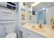 Bright bathroom with white cabinetry, a sink, and decorative accents at 89 S Atlantic Ave # 505, Ormond Beach, FL 32176