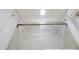 Bathroom shower with glass door and white tiled walls at 89 S Atlantic Ave # 505, Ormond Beach, FL 32176