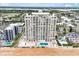 Stunning full exterior view of a high rise building featuring an outdoor swimming pool at 89 S Atlantic Ave # 505, Ormond Beach, FL 32176