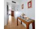 Well-lit hallway with tiled floors, stylish table, and wall art creates a welcoming atmosphere at 89 S Atlantic Ave # 505, Ormond Beach, FL 32176