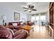 Cozy living room featuring comfortable seating and a sliding glass door to the balcony with ocean views at 89 S Atlantic Ave # 505, Ormond Beach, FL 32176