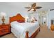 Comfortable main bedroom featuring carpet and a ceiling fan at 89 S Atlantic Ave # 505, Ormond Beach, FL 32176