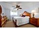 Comfortable main bedroom featuring carpet and a ceiling fan at 89 S Atlantic Ave # 505, Ormond Beach, FL 32176
