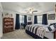 This bedroom has carpet flooring, a ceiling fan, and nautical decor at 1 Cobblestone Trl, Ormond Beach, FL 32174