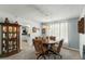 Charming dining room with a stylish chandelier and a dining set, ideal for entertaining guests at 1 Cobblestone Trl, Ormond Beach, FL 32174