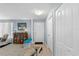 Bright entryway with tile flooring, coat closet, and a decorative wooden cabinet at 1 Cobblestone Trl, Ormond Beach, FL 32174