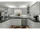Charming kitchen with a sink beneath a window and stainless steel appliances, for easy living at 1 Cobblestone Trl, Ormond Beach, FL 32174