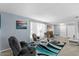 Spacious living room features comfortable seating and soft neutral carpeting at 1 Cobblestone Trl, Ormond Beach, FL 32174