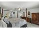 This main bedroom features a four-poster bed and ample wood furniture at 1 Cobblestone Trl, Ormond Beach, FL 32174