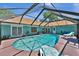 Picture of the in-ground screened pool with a patio area perfect for relaxing and entertaining at 1 Cobblestone Trl, Ormond Beach, FL 32174
