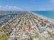 Aerial view of a beachside home near the ocean and inter-coastal waterway at 101 Egret Ave, Port Orange, FL 32127