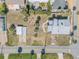 Aerial view of a two-story home in a coastal neighborhood, featuring palm trees and nearby amenities at 101 Egret Ave, Port Orange, FL 32127