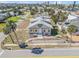 Aerial view of a two-story home in a neighborhood with palm trees and street view at 101 Egret Ave, Port Orange, FL 32127