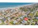 Aerial view of the neighborhood highlighting a property's location near the beach and amenities at 101 Egret Ave, Port Orange, FL 32127
