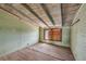 A bedroom with light green corrugated metal walls and ceiling, showing refurbishment potential at 101 Egret Ave, Port Orange, FL 32127
