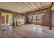 Renovation project showcasing hardwood flooring, exposed framing and plenty of sunlight at 101 Egret Ave, Port Orange, FL 32127