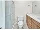 Bathroom with frosted glass enclosed shower, vanity, and toilet at 101 Grand Plaza Dr # A30, Orange City, FL 32763