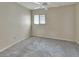 Bedroom featuring neutral-colored carpet and a window with blinds at 101 Grand Plaza Dr # A30, Orange City, FL 32763