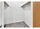 Walk-in closet with carpet and wooden rod at 101 Grand Plaza Dr # A30, Orange City, FL 32763