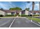 Well-kept condominium exterior with landscaped bushes and designated parking spaces at 101 Grand Plaza Dr # A30, Orange City, FL 32763