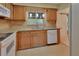 Functional kitchen featuring ample counter space, wooden cabinetry, and modern appliances at 101 Grand Plaza Dr # A30, Orange City, FL 32763