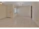 Spacious living room showcasing tile flooring and ample natural light with chandelier at 101 Grand Plaza Dr # A30, Orange City, FL 32763