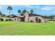 Expansive backyard featuring a well-maintained lawn and mature landscaping at 104 Nathan Hale Ct, Daytona Beach, FL 32119